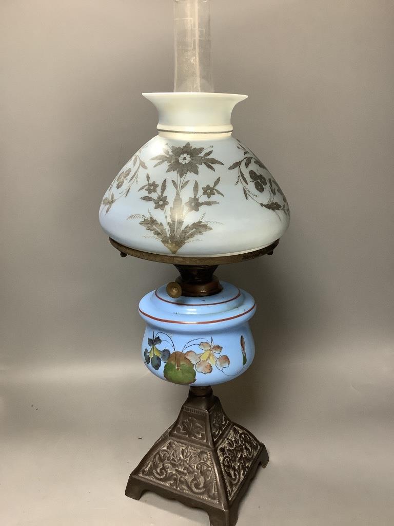 A French porcelain blue ground vase (converted to electricity) and a glass oil lamp